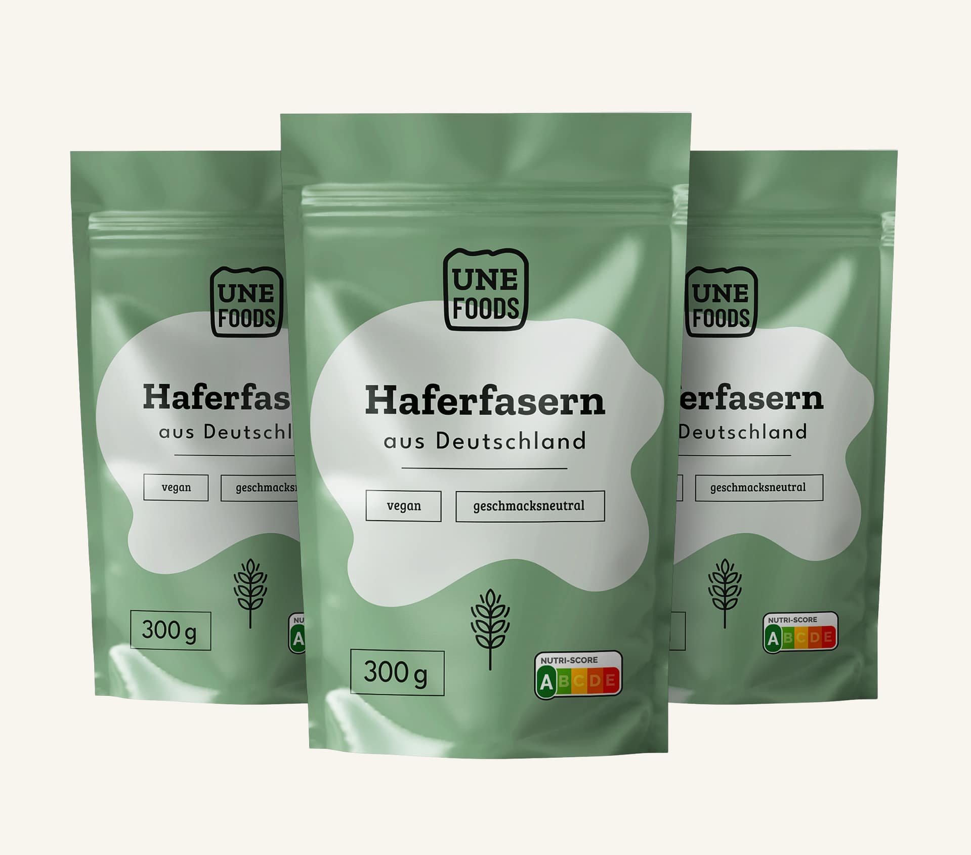 UNE FOODS Haferfasern aus Deutschland – lösliche Oat Fiber im grünen Standbeutel, Produktfoto mit drei Packungen.